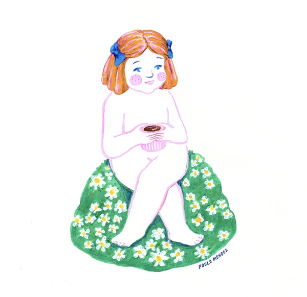 Red-haired girl sitting on a mound of flowers drinking coffee